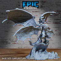 Emperor Dragon by Epic Miniatures: a gargantuan winged dragon rearing upright on a sculpted rocky base, wings spread wide, horned head snarling, heavy overlapping scales covering the muscular body and long tail.