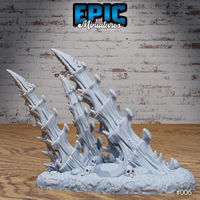 A bone spike terrain piece shown from close range, highlighting the deeply textured surface of the twisted bone columns, individual knobs and ridges, and the detail of the skull-covered rubble base. Sculpt by Epic Miniatures.