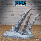 Two assembled bone spike terrain pieces on a shared rubble base displayed from a slightly elevated angle, showing both pieces together and the full extent of the skull and bone debris surrounding them. Sculpt by Epic Miniatures.