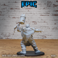 Hill giant sculpt seen from behind, revealing a long shaggy mane, a tattered trophy cloak hung with a skull charm, claw-tipped gauntlet raised, and layered armour with bone decorations at the waist. Sculpt by Epic Miniatures.