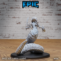 Lamia miniature by Epic Miniatures — viewed from behind and to the side, revealing the full mass of heavily scaled serpent coils forming the lower body, flowing dress fabric and long hair visible, sword raised overhead, flame trailing from outstretched hand.