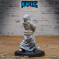 Robed cultist figure seen from behind, hands clasped in prayer raised slightly, hood draped over head, rope belt visible with hanging tassel detail, ornate clasp fastenings on back. Sculpt by Epic Miniatures.
