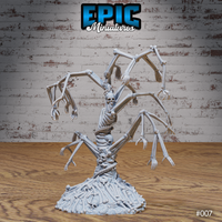 Front-facing Bone Tree miniature — a towering column of fused skeletons with multiple branching arms ending in splayed hands, a skull visible at centre, rising from a base of compacted bones and skulls. Sculpt by Epic Miniatures.
