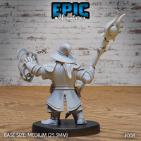 Dwarf wizard seen from behind, both arms raised — staff with forked flame finial in one hand, swirling arcane rings in the other, broad pauldrons and long belted coat visible. Sculpt by Epic Miniatures.