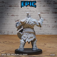 Orc warrior seen from behind, showing a broad back with a sash harness, mohawked topknot, round shield held low, mace raised overhead, and wrapped leg bindings. Sculpt by Epic Miniatures.