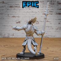 Lizardfolk warrior viewed from behind, revealing a long muscular tail sweeping low, detailed back scales, layered pauldrons and bracers, feathered crest fanning from the crown. Spiked polearm raised at the side. Sculpt by Epic Miniatures.