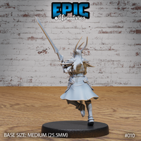 Female dark elf warrior seen from behind, longsword raised diagonally overhead, hair fanning out mid-stride. Detailed back armour, flared armoured coat, knee-high boots. Epic Miniatures sculpt.