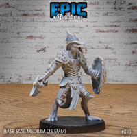 Lizardfolk warrior facing forward, mouth open showing rows of teeth, dorsal fin-crest raised, wielding a hand axe and a broad tortoiseshell shield, wearing spiked pauldrons and bone-plate armour. Sculpt by Epic Miniatures.