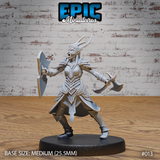 Female dark elf warrior in horned plate armour, mouth open in a battle-cry, hand axe raised in right hand and broad shield held left, wide combat stance. Sculpt by Epic Miniatures.