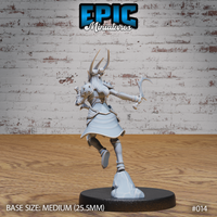 Dark elf female warrior seen from behind, long hair flowing, dual crescent scythes extended, spiked pauldrons and engraved plate armour visible across her back, standing on a rocky base. Sculpt by Epic Miniatures.