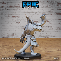 Armoured lizardfolk warrior viewed from behind, showing prominent dorsal spine crest, overlapping shoulder guards, articulated bracers, and the raised war horn above the head. Sculpt by Epic Miniatures.