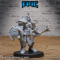 Heavily armoured orc warrior standing upright, holding a large angular shield in his left hand and a vicious spiked mace gauntlet on his right arm, wearing studded plate armour with spiked pauldrons, a crested helmet, fur-trimmed cloak, and a skull medallion. Sculpt by Epic Miniatures.
