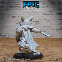 Cat-folk warrior seen from behind, long stitched cloak swept to one side, quilted back armour visible, spear extending outward, tail curling beneath cloak hem, thick layered fur detail across shoulders and arms. Sculpt by Epic Miniatures.