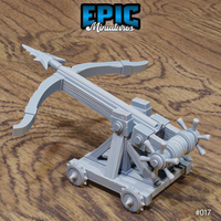 Siege ballista with torsion arm angled upward and barbed finned bolt aimed forward, showing the crossed timber A-frame chassis and iron-banded wheels. Sculpt by Epic Miniatures.