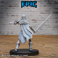 Skeleton warlord from behind, a long sweeping cape draping to the base, spiked crown atop the skull, longsword raised in the right hand, armoured legs and greaves visible. Sculpt by Epic Miniatures.