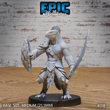 Lizardfolk warrior miniature facing forward, holding a serrated blade raised to the right and a wide rune-etched shield extended to the left, wearing layered scale armour with a cord necklace. Sculpt by Epic Miniatures.