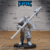 Heavily built orc warrior holding a large spiked halberd across his body with both hands, wearing horned helmet, skull-adorned chest armour, bone trinkets and fur-trimmed cloak. Sculpt by Epic Miniatures.