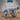Spiked war cannon facing right, with a wide octagonal barrel, studded spoke-wheels ringed with conical spikes, and a crosshatched wooden carriage trail. Sculpt by Epic Miniatures.