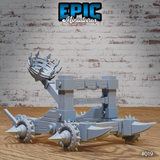 Dark Catapult war machine with arm raised and spiked iron basket aloft, showing the full wheeled chassis with spike-tipped axles and heavy timber frame. Sculpt by Epic Miniatures.