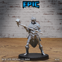 Skeleton warrior in a horned crown and plate armour, gripping a long-hafted hammer-axe at mid-swing height, wide-legged stance, skull-decorated belt plate, flowing cloak, sculpted by Epic Miniatures.