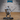 Armoured skeleton miniature standing with sword extended and heater shield raised, wearing a flame-tipped crown and flowing cloak, skull motifs on belt and shield, by Epic Miniatures.