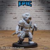 Snarling dog-headed warrior in layered leather armour, wielding two short axes in a forward-lunging stance, with fur-lined body and riveted shoulder plates. Sculpt by Epic Miniatures.