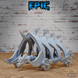 Dragon Head Battle Ram by Epic Miniatures — wheeled siege vehicle with a snarling draconic figurehead, swept dorsal fins, riveted armour plates, curved blades, and spiked wheels.