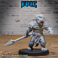 Stocky canine-headed warrior lunging forward with a two-handed spear, wearing stitched leather armour, buckled belt, and shoulder cape. Snarling expression, fangs bared. Sculpt by Epic Miniatures.