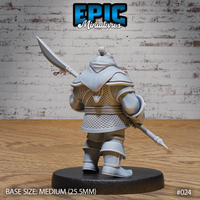 Dwarf miniature seen from behind, showing detailed scale-mail coat, cloth wrap at the waist, pauldrons, and a polearm angled downward past the right leg. Sculpt by Epic Miniatures.