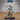 Lizardfolk soldier in articulated plate armour holding a crossbow extended forward, tail sweeping low, large cylindrical quiver on back. Sculpt by Epic Miniatures.