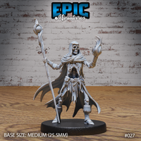 Skeleton wizard standing upright, raising a skeletal hand wreathed in arcane flame, gripping a tall orb-topped staff. Ragged hooded robes expose bare ribs. Sculpt by Epic Miniatures.