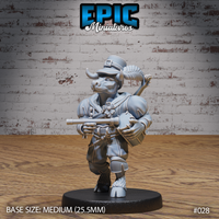 Stocky minotaur bard gripping a crossbow at chest height, wearing a buckled top hat and layered coat with a shamrock detail, crossbow slung forward; fiddle and bedroll visible across his back. Sculpt by Epic Miniatures.