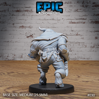 Minotaur rogue miniature seen from behind, showing a slung satchel, sheathed blade at the hip, ring of keys on the belt, and dense fur covering the hooved lower legs. Sculpt by Epic Miniatures.