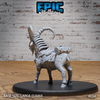 Rear three-quarter view of armoured goat miniature showing curling spiral horn, strapped saddlebags with cylindrical clasps, shaggy textured fur, and leather barding detail. Sculpt by Epic Miniatures.