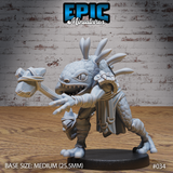Lizardfolk martial artist in a low fighting stance, fists cloth-wrapped, jaws wide open in a snarl, with a fan of spines rising from the head and layered straps across the torso. Sculpt by Epic Miniatures.