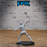 Armoured skeleton warrior seen from behind, spiked mace thrust upward, pauldrons and segmented back armour visible, wide-legged attacking pose, chainmail skirt detail prominent. Sculpt by Epic Miniatures.