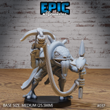 Scaly river folk warrior striding forward, holding a rope-bound crossbow aloft and a fish-tipped spear in the other hand. Toothy grin, dorsal spines, scaled chest. Medium round base. Epic Miniatures.