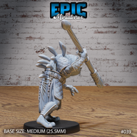 Frogfolk warrior viewed from behind and to the side, spear held vertically overhead in one clawed hand, dorsal spines clearly visible along the skull and shoulders, studded belt and quilted leg armour detailed. Sculpt by Epic Miniatures.