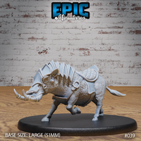 Armoured warthog miniature lunging forward with head low, iron face mask fitted over its snout, segmented spine barding, quilted saddle, and heavy buckled chest strap. Sculpt by Epic Miniatures.