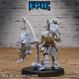 Goblin fisherman miniature seen from behind, braided hair tied back, gripping a tall wooden fishing rod, large detailed fish suspended from the line. Layered roughspun tunic, rope-bound legs, scattered rock and tuft base. By Epic Miniatures.