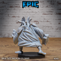 Rear view of a frogfolk wizard showing scaled armour across the shoulders, toggle fastenings down the back of the robe, and elongated ears above the wide-brimmed hat. Sculpt by Epic Miniatures.