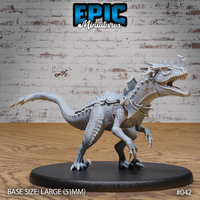 Armoured raptor miniature lunging forward with jaws wide open, spiked neck guard and shoulder plate armour, raised foreclaws, long balancing tail, on a large oval base. Sculpt by Epic Miniatures.