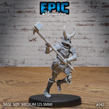 Armoured skeleton warrior mid-stride, raising a broad-headed maul overhead with both hands. Skull-motif breastplate, horned helm, quilted tassets, and layered pauldrons. Sculpt by Epic Miniatures.