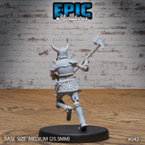Armoured skeleton warrior seen from behind, striding forward with a spiked maul extended at arm's length. Full plate back armour, horned helm, quilted lower armour, and skeletal feet visible. Sculpt by Epic Miniatures.