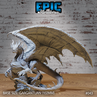 Chaos Red Dragon Ancient by Epic Miniatures — large dragon rearing on rocky rubble base, right wing swept high and wide, heavily horned head turned to one side, thick overlapping scales across body and tail, 102mm gargantuan base.