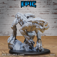 Cave Crawler by Epic Miniatures — heavily armoured reptilian beast crouched low, sabre tusks bared, clawed feet gripping rocky terrain on a 51mm base. Sculpt by Epic Miniatures.