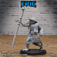 Kenku wizard crouching with a long cord-wrapped staff raised overhead in one hand, wearing layered robes, a structured woven hat, and carrying a basket at the hip. Talon feet visible. Sculpt by Epic Miniatures.