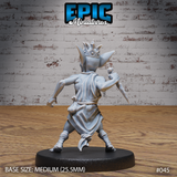 Goblin Tribe King miniature by Epic Miniatures — rear view showing spiked studded crown, flowing rope-belted tunic with natural fabric folds, and bound lower legs; dagger visible raised behind shoulder.
