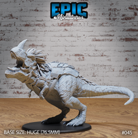 Saddled tyrannosaur miniature lunging forward with jaws wide open, single nasal horn, braided mane, rope harness and armoured saddle panels across its back. Sculpt by Epic Miniatures.
