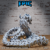 Thorn Wyrm by Epic Miniatures: overhead angle showing the full coiled body in detail — overlapping scales, spiked protrusions along the flanks, and a barbed club-like tail tip resting on a sculpted decorative base.